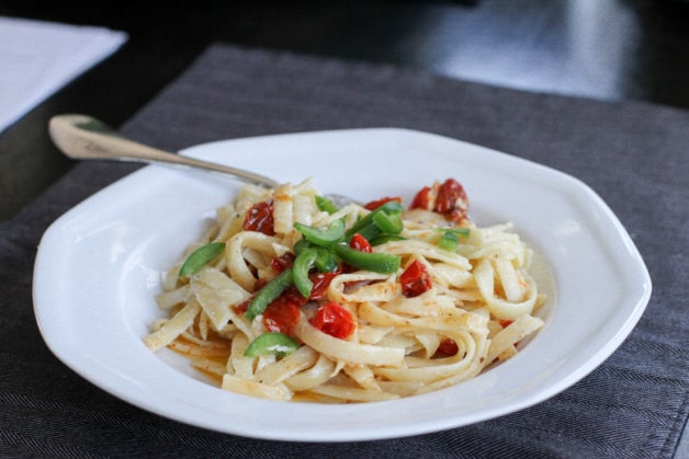 pasta alfredo with roasted tomatoes.