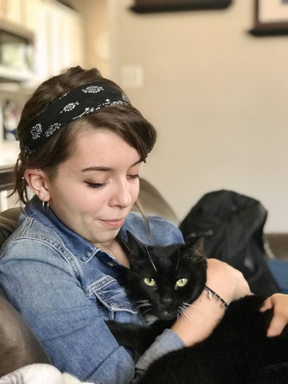 Lisey snuggling the cat.