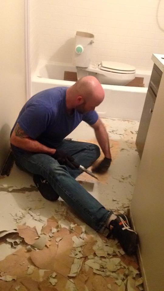 Reese's husband ripping out tile.