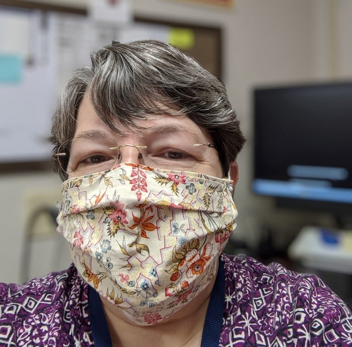 Reader Ruby in a mask.