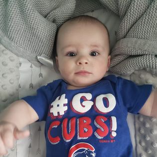 Reese's baby in a cubs onesie.