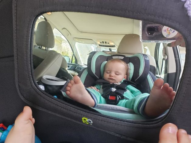 Sleeping baby in a mirror.