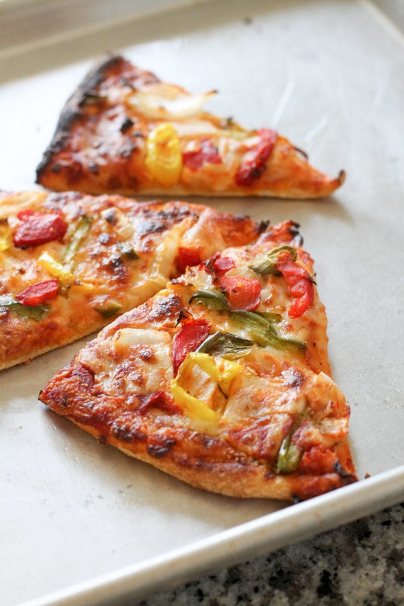 Three slices of veggie pizza.