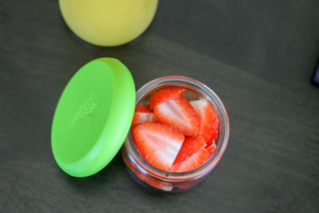 Oui yogurt container with strawberries inside.