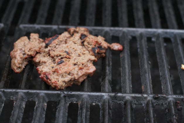 torn hamburger on grill.