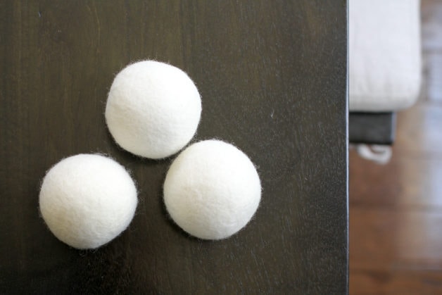 Three wool dryer balls on a table.