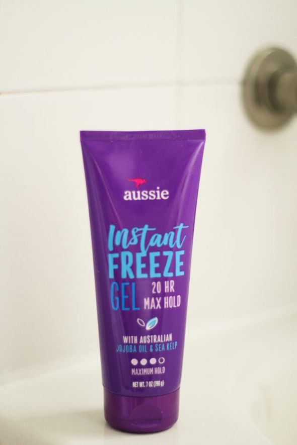 Purple container of Aussie Instant Freeze hair gel.