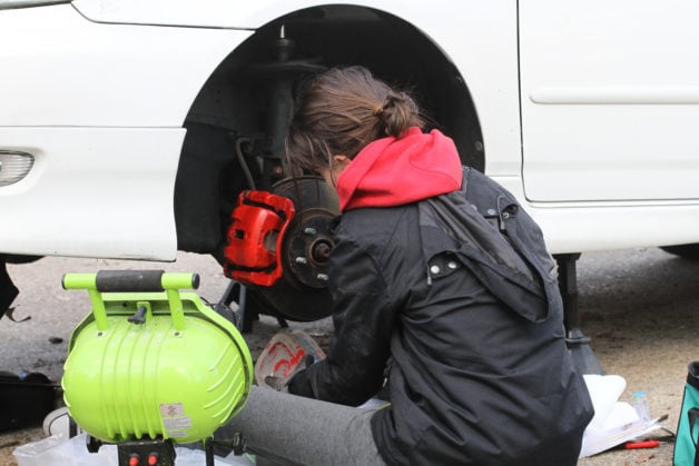 Lisey painting her calipers red.