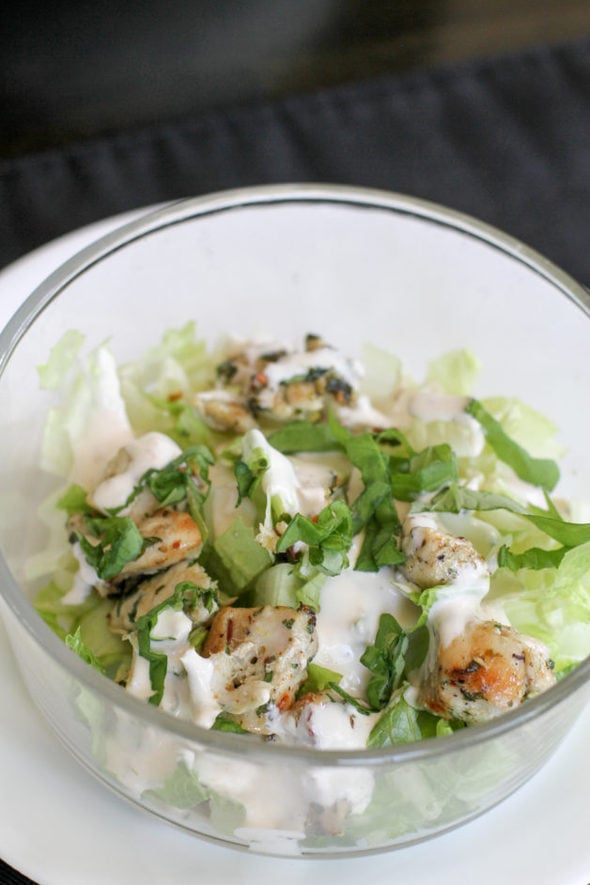 Chicken spiedies salad in a glass bowl.