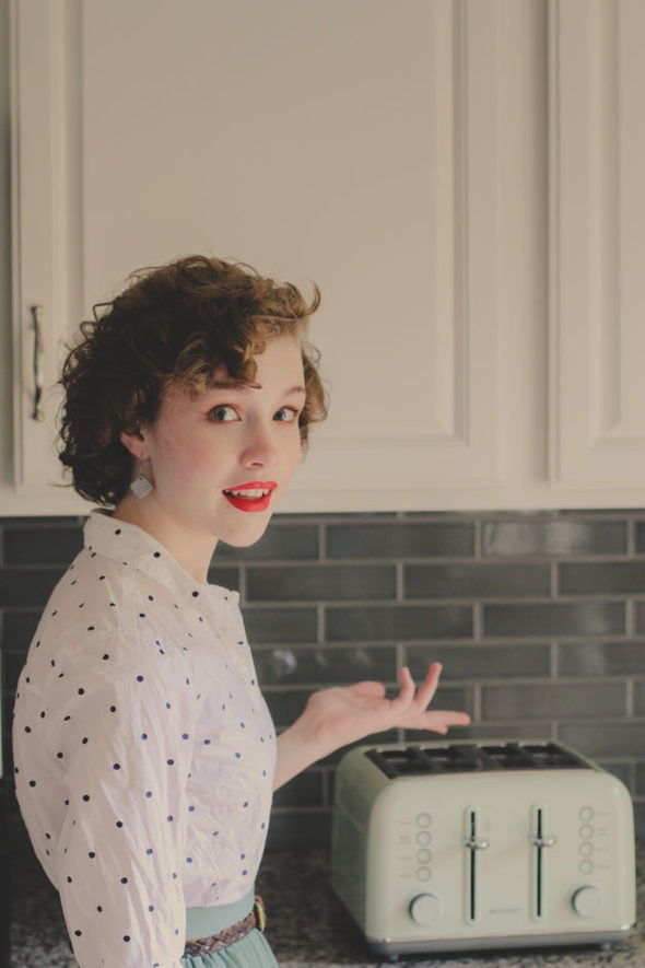 Sonia standing in front of a Buydeem toaster.