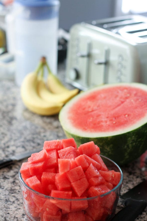 A glass bowl of watermelon cubes.