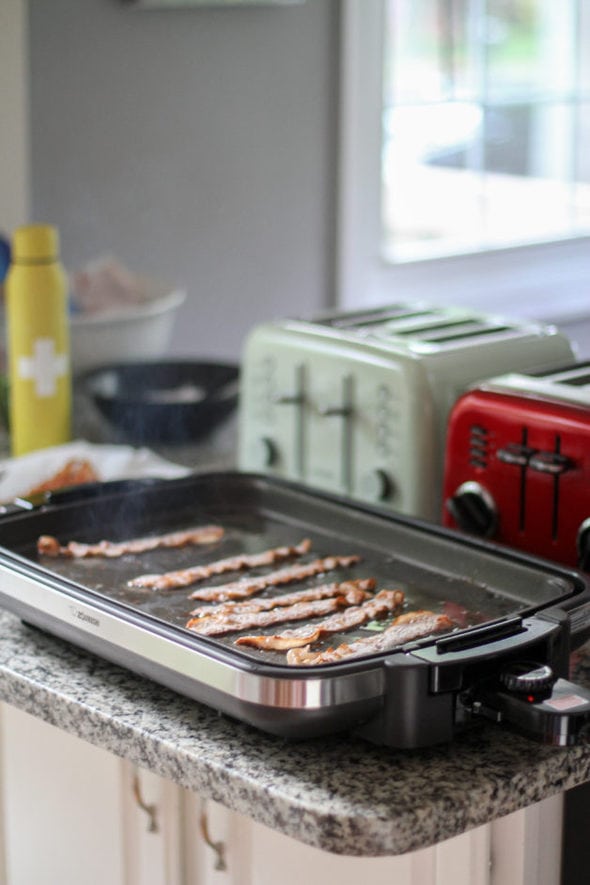 Bacon cooking on a Zojirushi griddle.