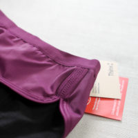 A close-up view of a pair of purple Thinx underwear.