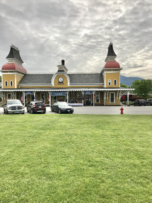 A train station under cloudy skies.