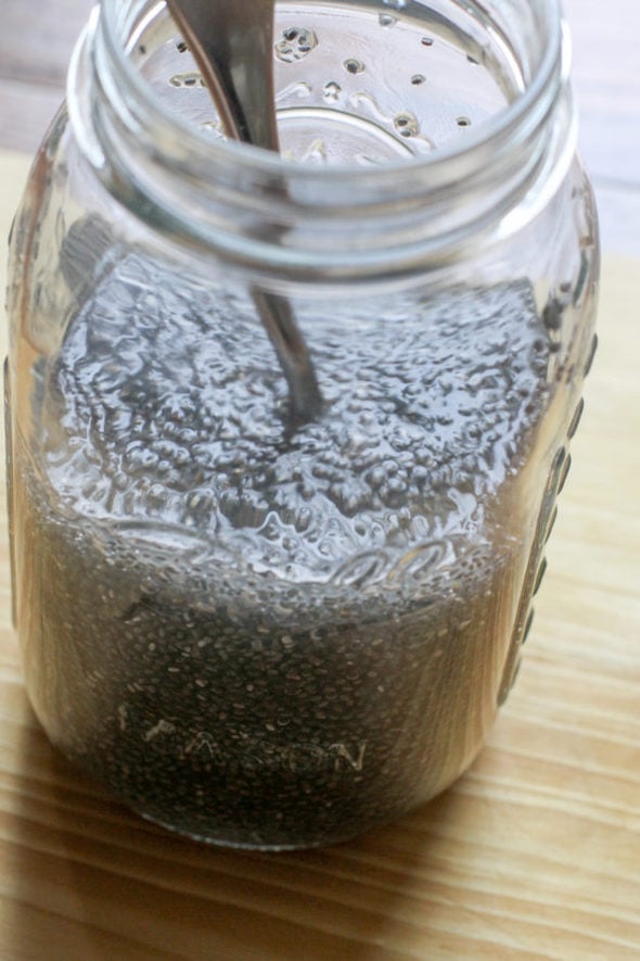 Chia seeds mixed with water in a Mason jar.