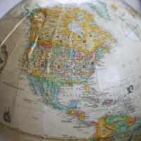 North American on a globe.