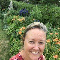 Shelagh in a flower garden.