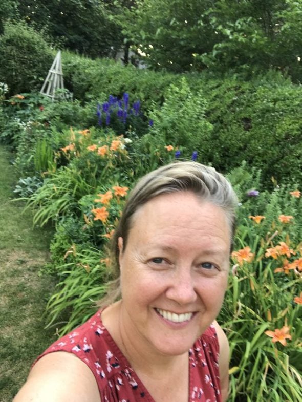 Shelagh in a flower garden.