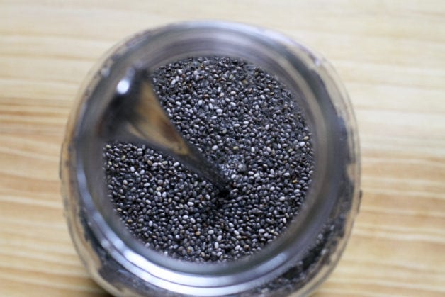 Chia seeds mixed with water in a Mason jar.