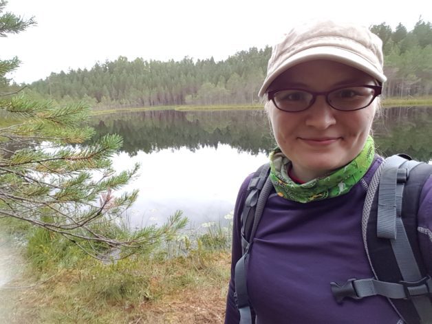 Reader Kaisa in front of a lake.