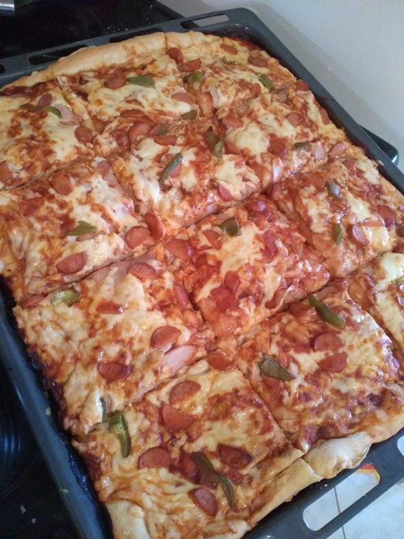 A rectangular homemade pizza.