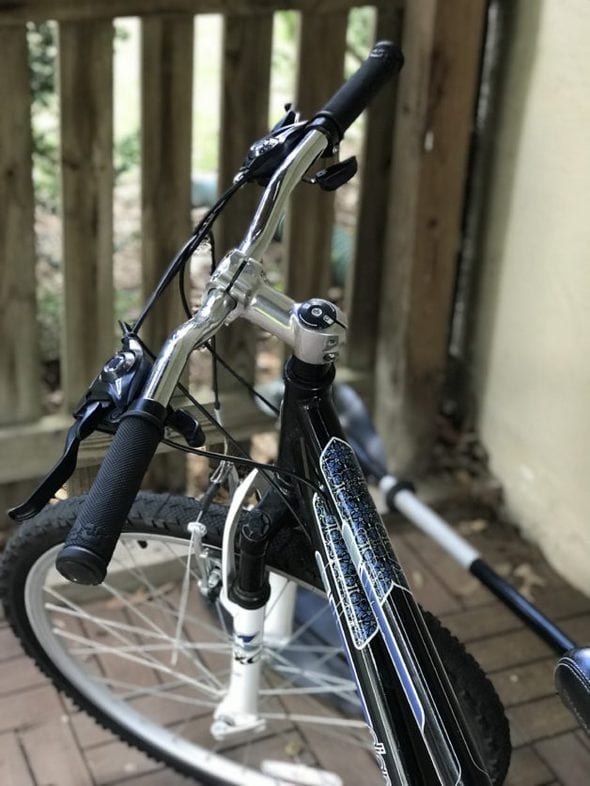 A black and blue hybrid bicycle.