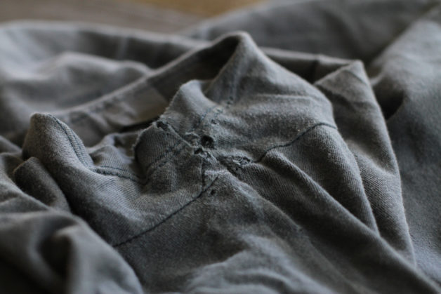 Tshirt with holes in the armpit.