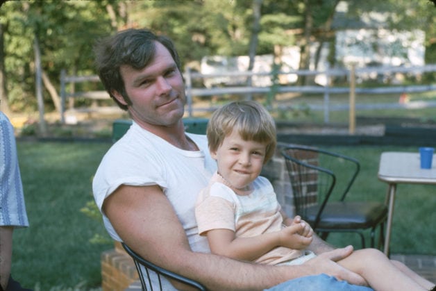 Kristen as a child, sitting in her uncle's lap.