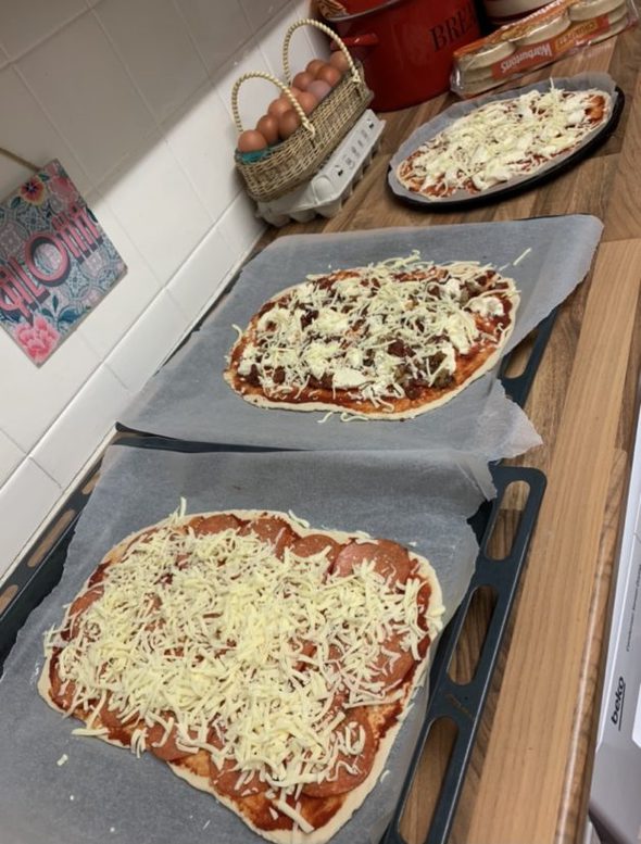 Homemade pizzas ready to bake.