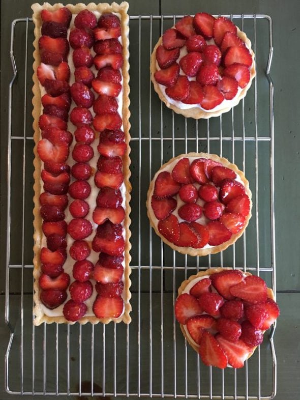 Four homemade strawberry tarts.