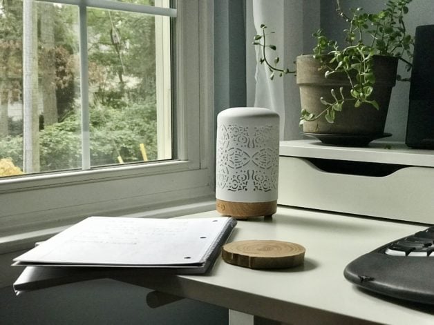 A white desk by a window.