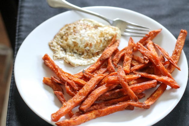 A fried egg and sweet potato fries.