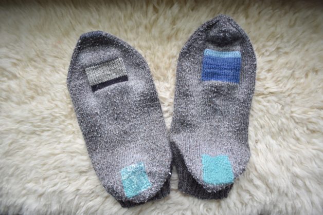 Mended gray socks.