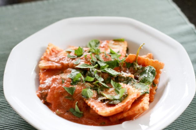 Ravioli in a white bowl.