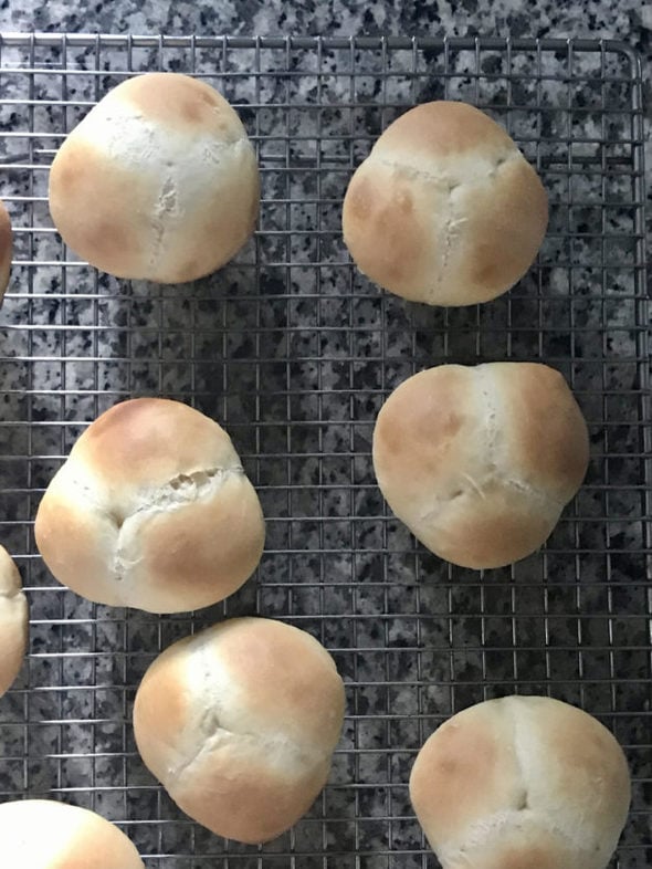 cloverleaf rolls on a cooling rack.