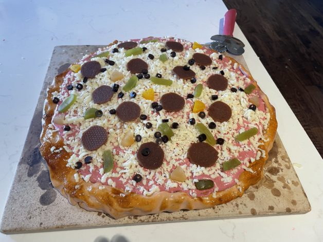 A cake made to look like a pizza.