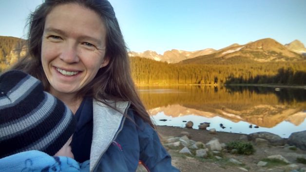 Dorinda in front of a lake.