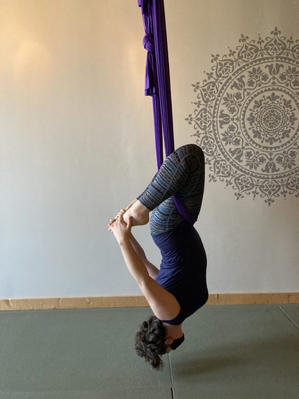 Susannah doing aerial yoga.