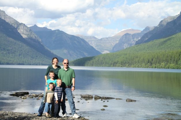 Dorinda and her family in front of mountains.