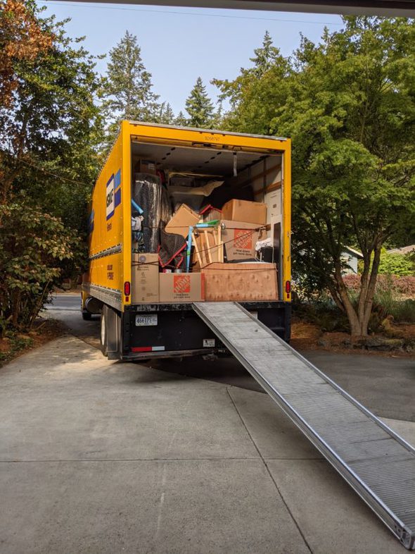 A big yellow moving truck.