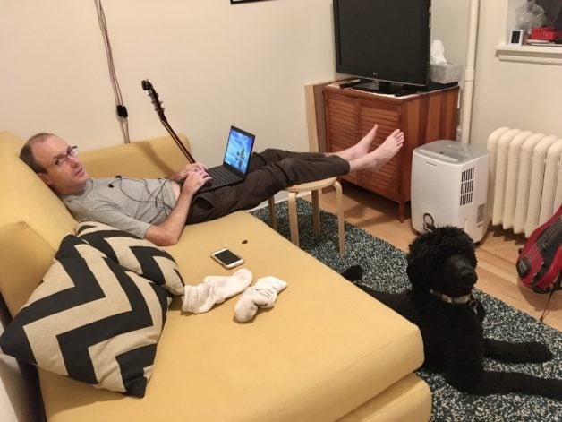 Stephanie's husband and dog relaxing together.