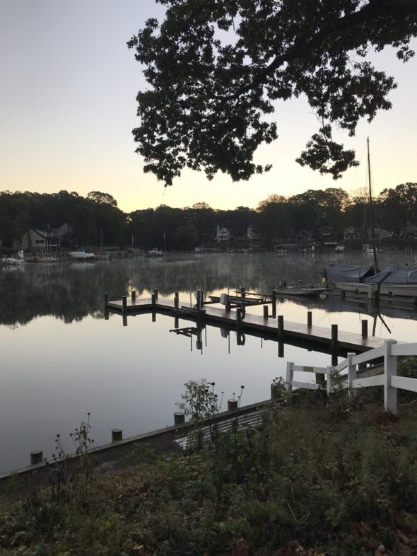 A river scene at sunrise.