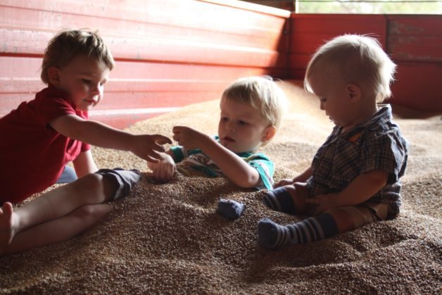 Three little boys sitting.