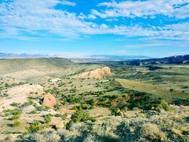 Flat landscape under blue skies.