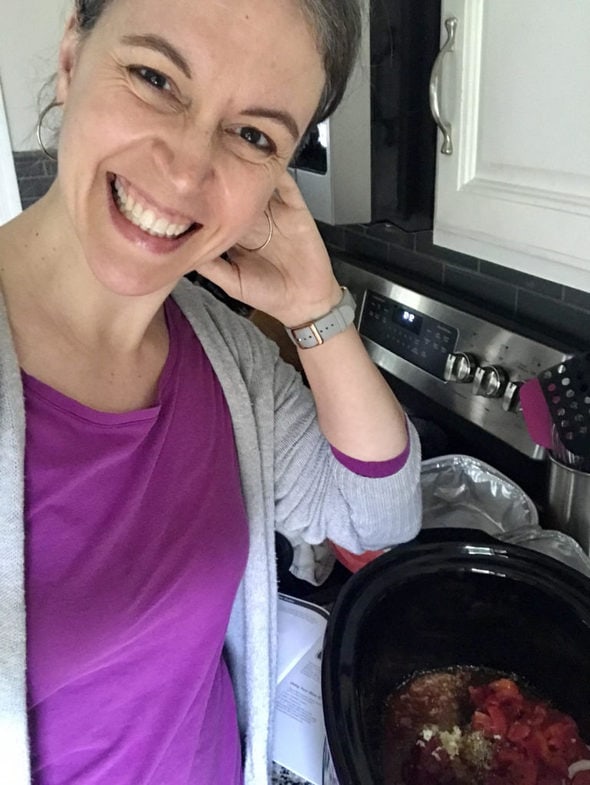 Kristen next to her crockpot.