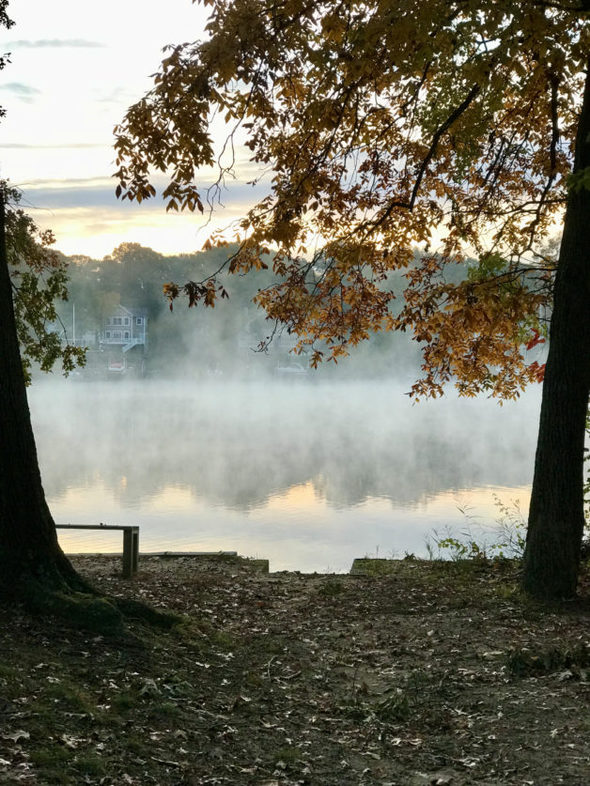 a river with steam rising off it.