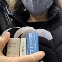 Kristen holding three library books.