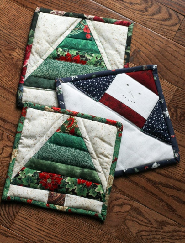 quilted potholders with christmas designs.