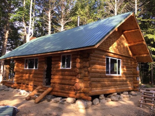 A log cabin in the woods.