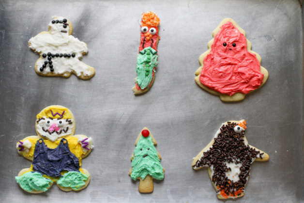 Six cookies on a cookie sheet.